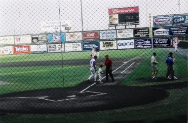Man and son walking off field